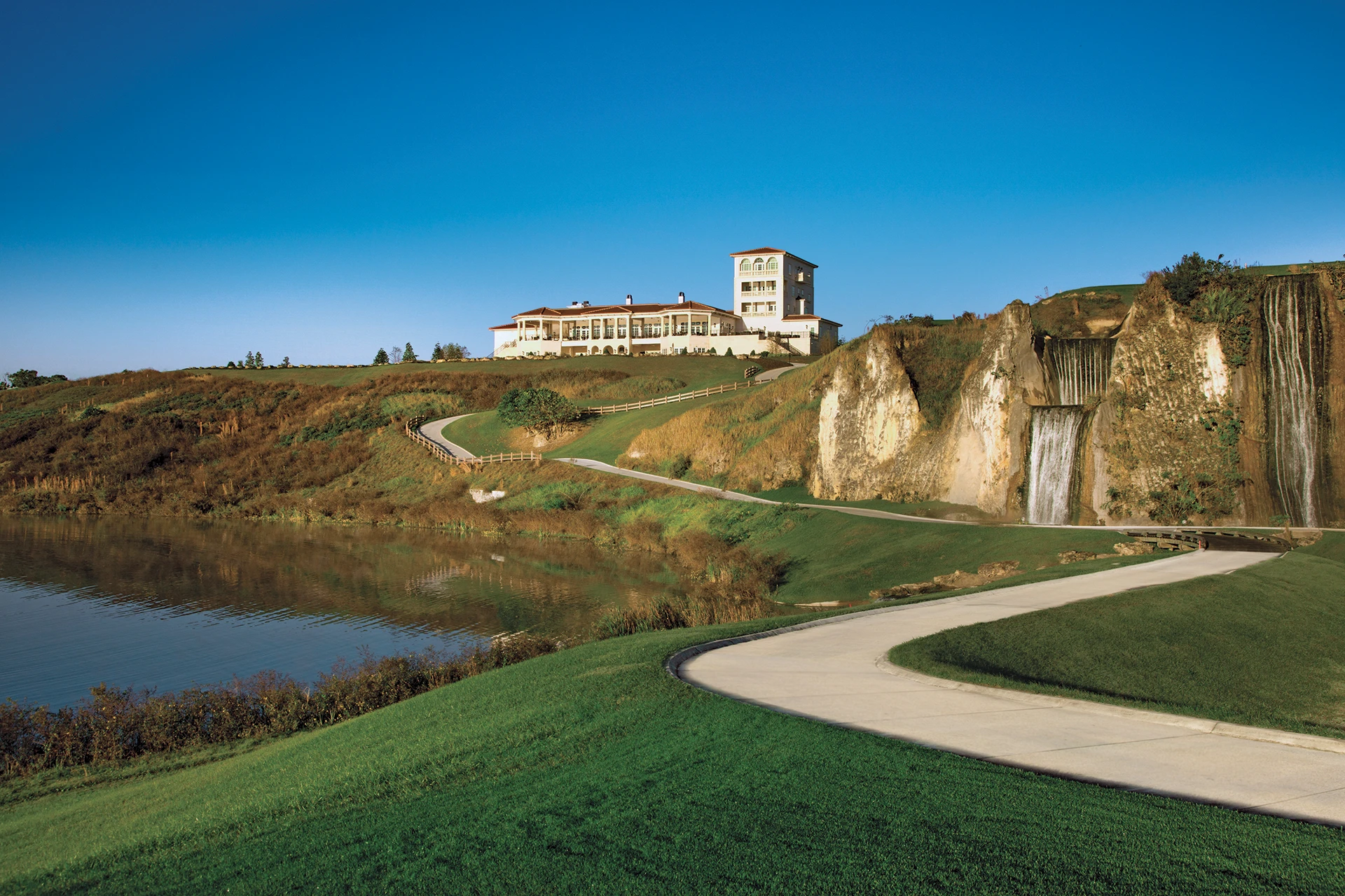 The Club at Iron Lake clubhouse overlooking Iron Lake and the quarry landscape at IronCrest in Ocala, Florida.