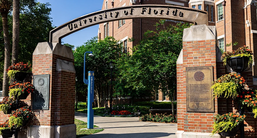 University of Florida entrance arch and brick campus buildings in Gainesville, Florida.